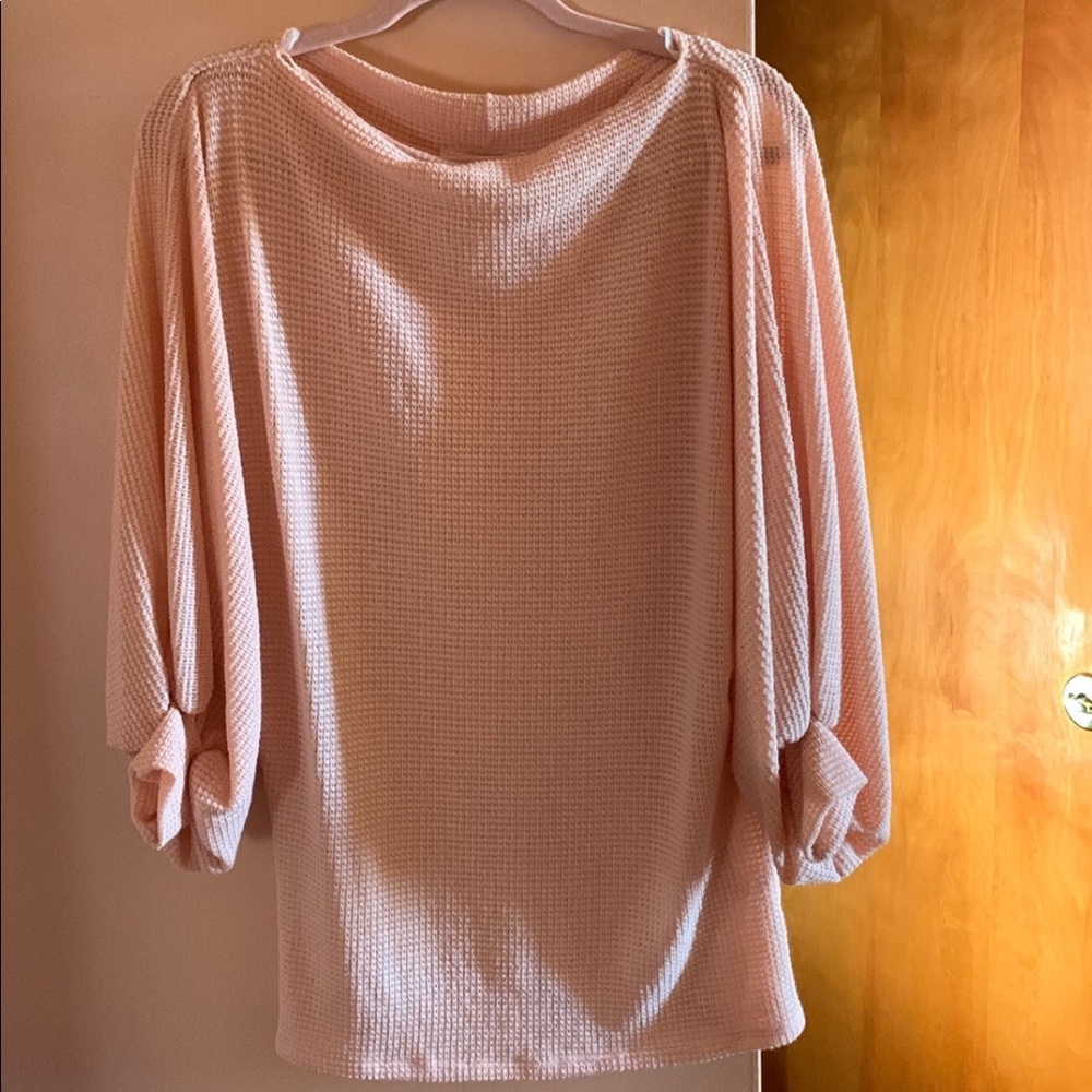 Light pink knit tunic.